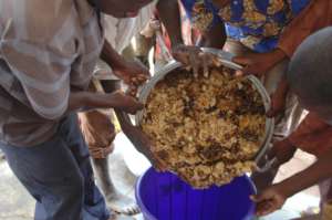Honey being transfered to a plastic container 1