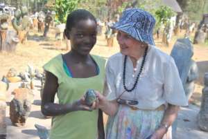 Edone with a young student in Zimbabwe