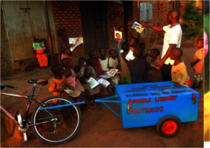 Books by bike - the library arrives at a village.