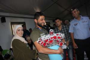 A volunteer gives out flowers at the WMHD event
