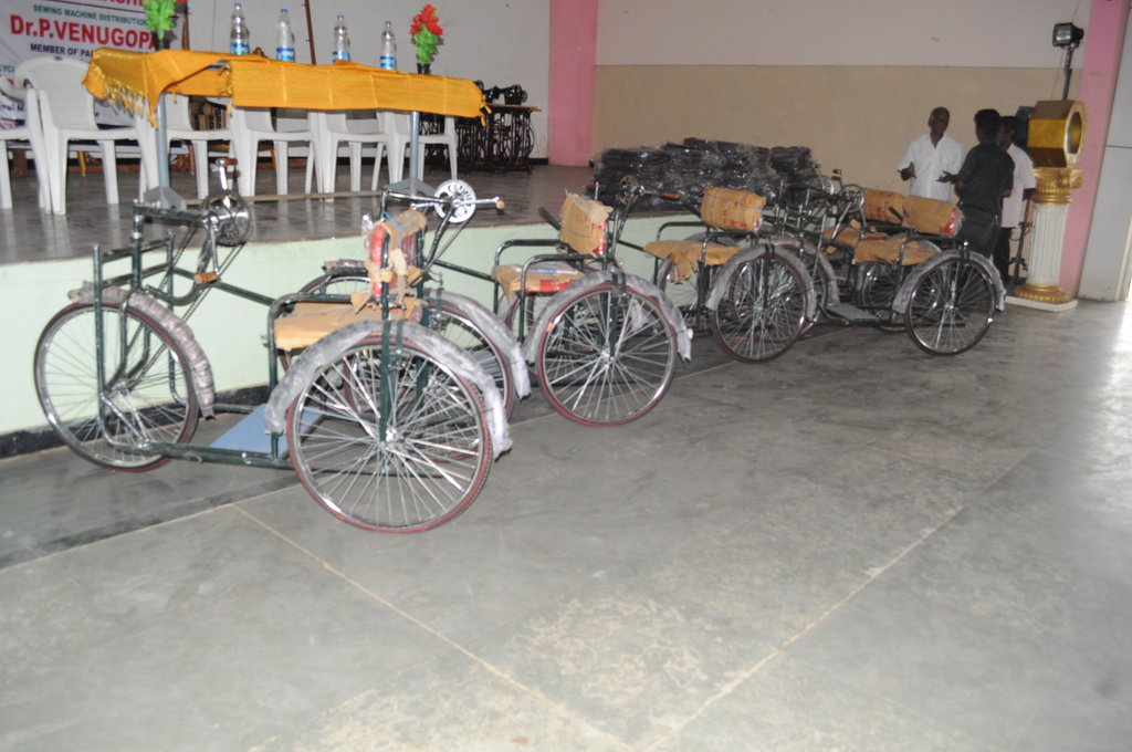 Tricycles, Hearing Aids to Disabled Children