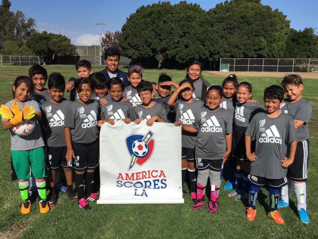 Coach Miguel (Alumni) with Braddock Drive kids