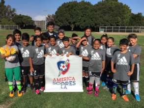 Coach Miguel (Alumni) with Braddock Drive kids