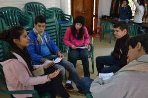Aymara discussing with fellow leaders