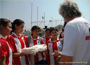 The team presenting gifts to HWC Founder Mel Young