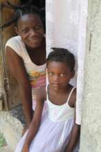 A woman and child with Consider Haiti