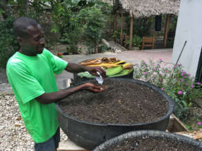 Sowing seeds in a tire garden, FONDAMA