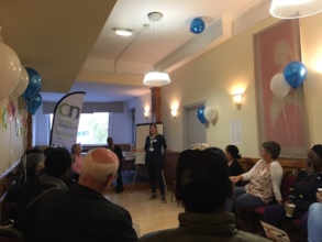 Rose welcomes the group to launch event
