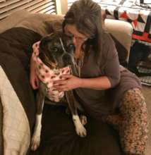 Zena snuggled by foster Mom