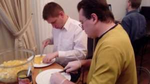 Mikhail and George  prepare food for lunch