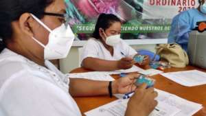 Healthcare Workers Processing Maijuna Vaccinations