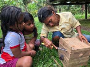 Grandmother Beekeeping with Granddaughters