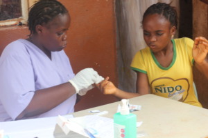 Mabinty being tested for Malaria