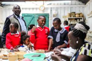 Teacher Alex with students at Kazuri Beads Center