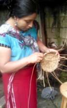 Girls learn to make baskets to sell in the market
