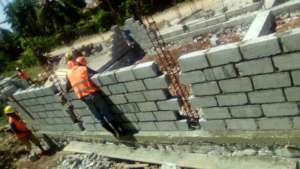 Trainees work on one of the building sites