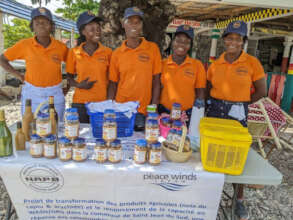 Women's group members sell cashews at local market