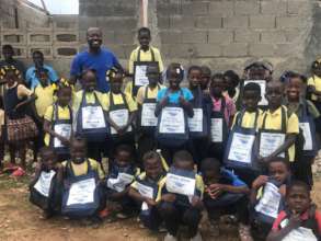 Primary school students with their supplies