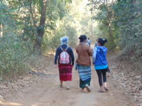 Outreach team walking to the next village