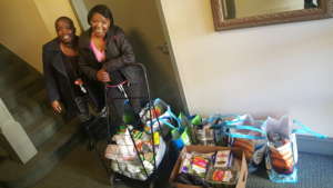 Donna & Nicole Pose with Food Bank Finds