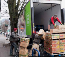 Volunteers unload food delivery for Clay Street.