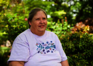 Cindy helps serve her neighbors
