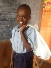 Pupil carrying school books in plastic bag