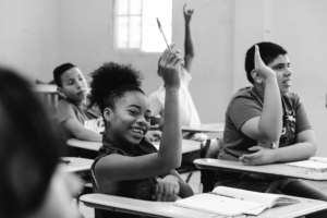 Girl raising her hand for quality education