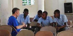 IESC volunteer with Haitian students