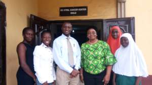 Our staff and Kosj (Moffitt) outside the clinic