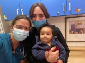 Working with Dr. Veronica atteding a baby patient