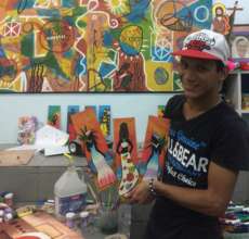 Hanthonyz at the art workshop with his paintings