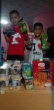 Some children receiving some toys and food
