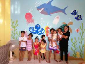 Some of our kids in front of the new painting