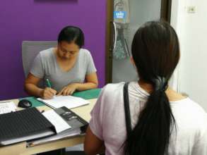 One of the new woman during her intake with Staff