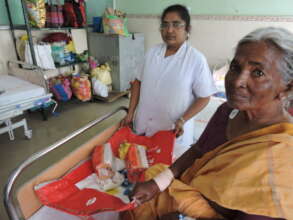 Elderly poor patient in hospital getting nutrition
