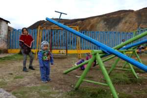 children playing near the rubble