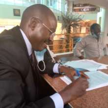 Signing the papers for the purchaseof USPCA land