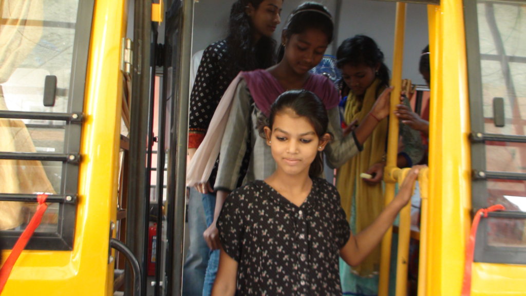 The girls of the EOW project inside the new bus.