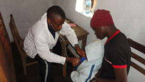 Dr. Tembon Consulting a Patient at Ngemsibo