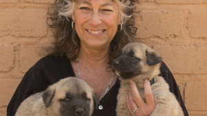 Laurie Marker with Anatolian Puppies