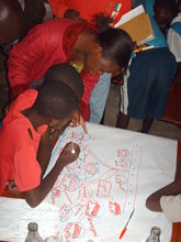 School children reviewing sanitation plan