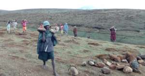 Locals collecting building materials