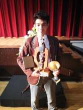 Chadleigh with a few of his academic awards
