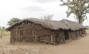 Full length view of the mud & thatch structure