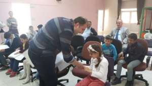 Blind Children receiving their new braille books