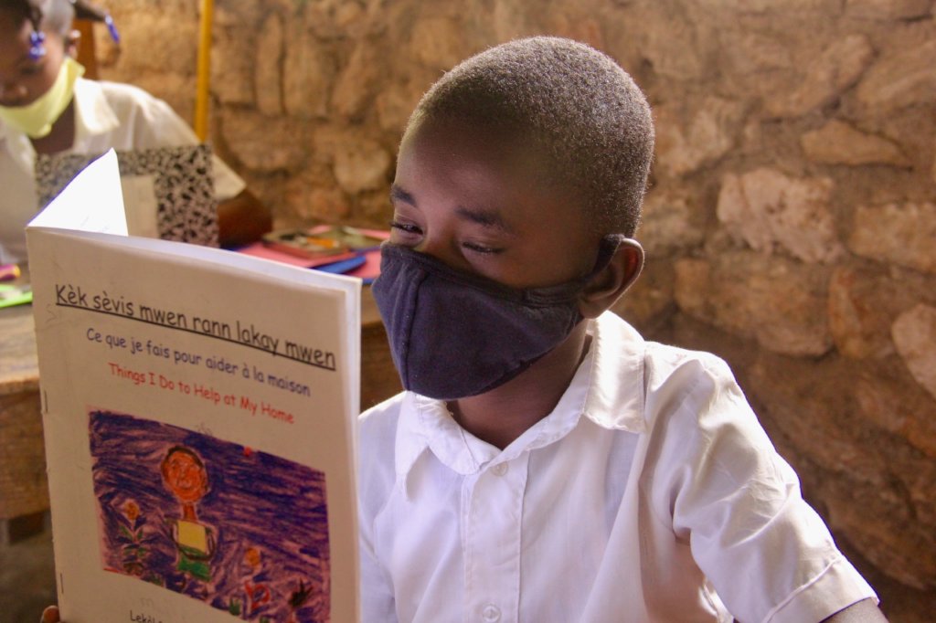 A student reads a Mother Tongue book on Lagonav.