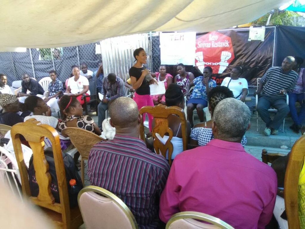 An Adult Survivor shares her story at a gathering.