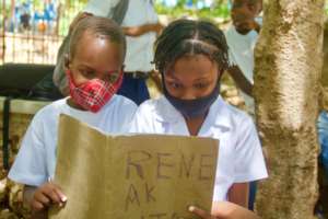 Reading a book written by fellow students.