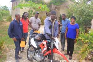 Education Ministry officials accept gift of moto.